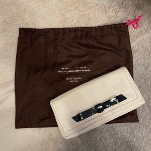 Kate Spade cream clutch with duster